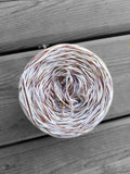 White, off white, ivory, and brown variegated yarn