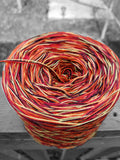 black, yellow, orange, red and burgundy variegated yarn