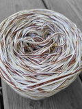 White, off white, ivory, and brown variegated yarn